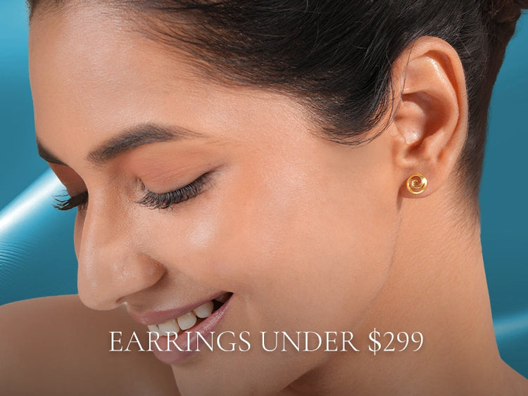 Dainty gold earrings by Vairam for under $299, crafted for lightness and charm.