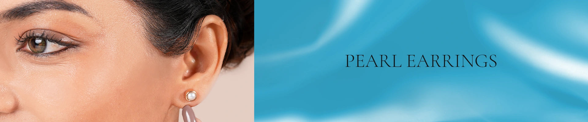 Natural pearl earrings from Vairam, bringing a graceful finish to minimalist styling.
